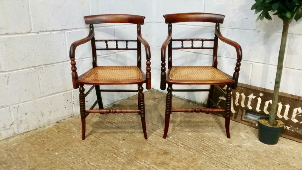 antique pair regency bergere elbow chairs c1820