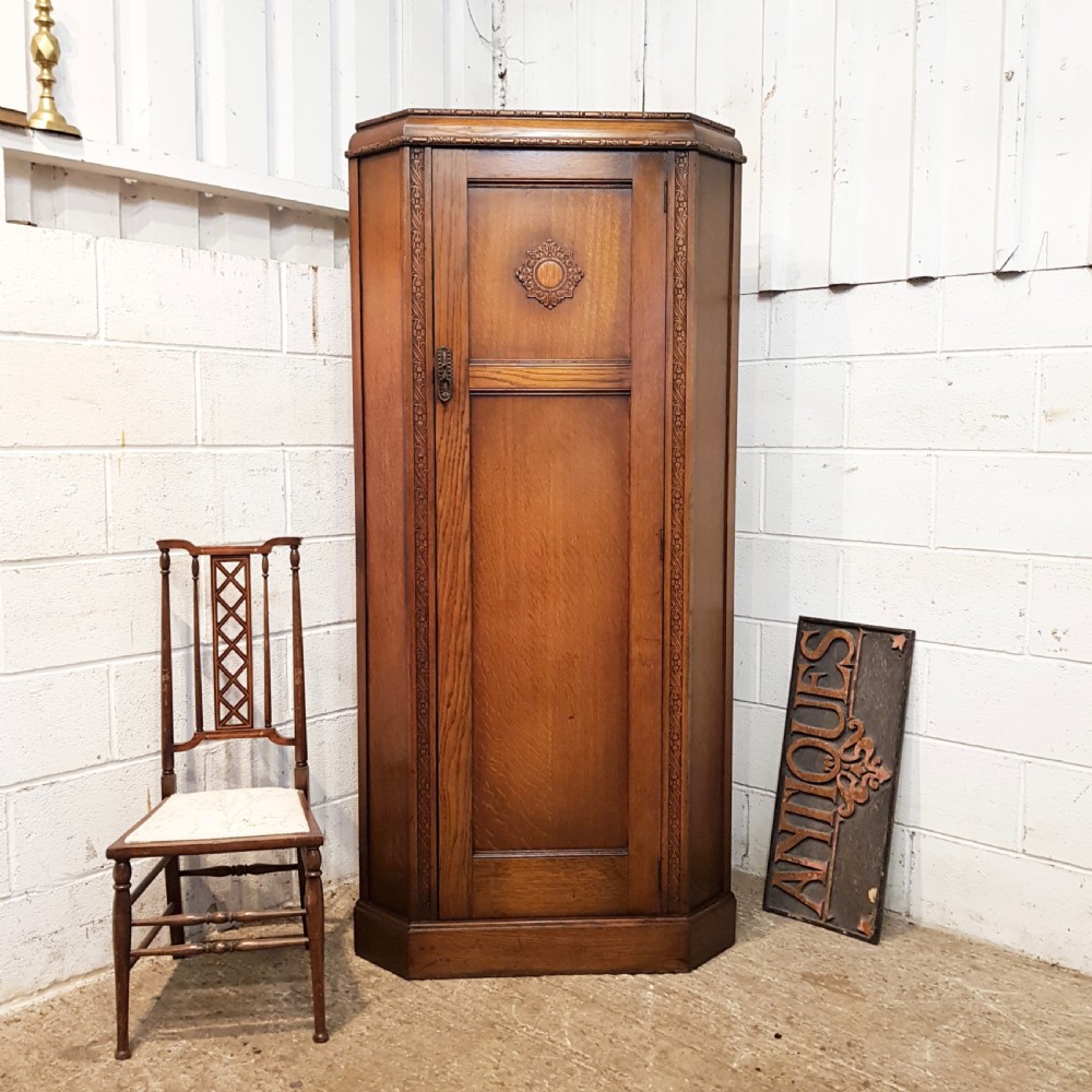 antique carved oak corner wardrobe c1920