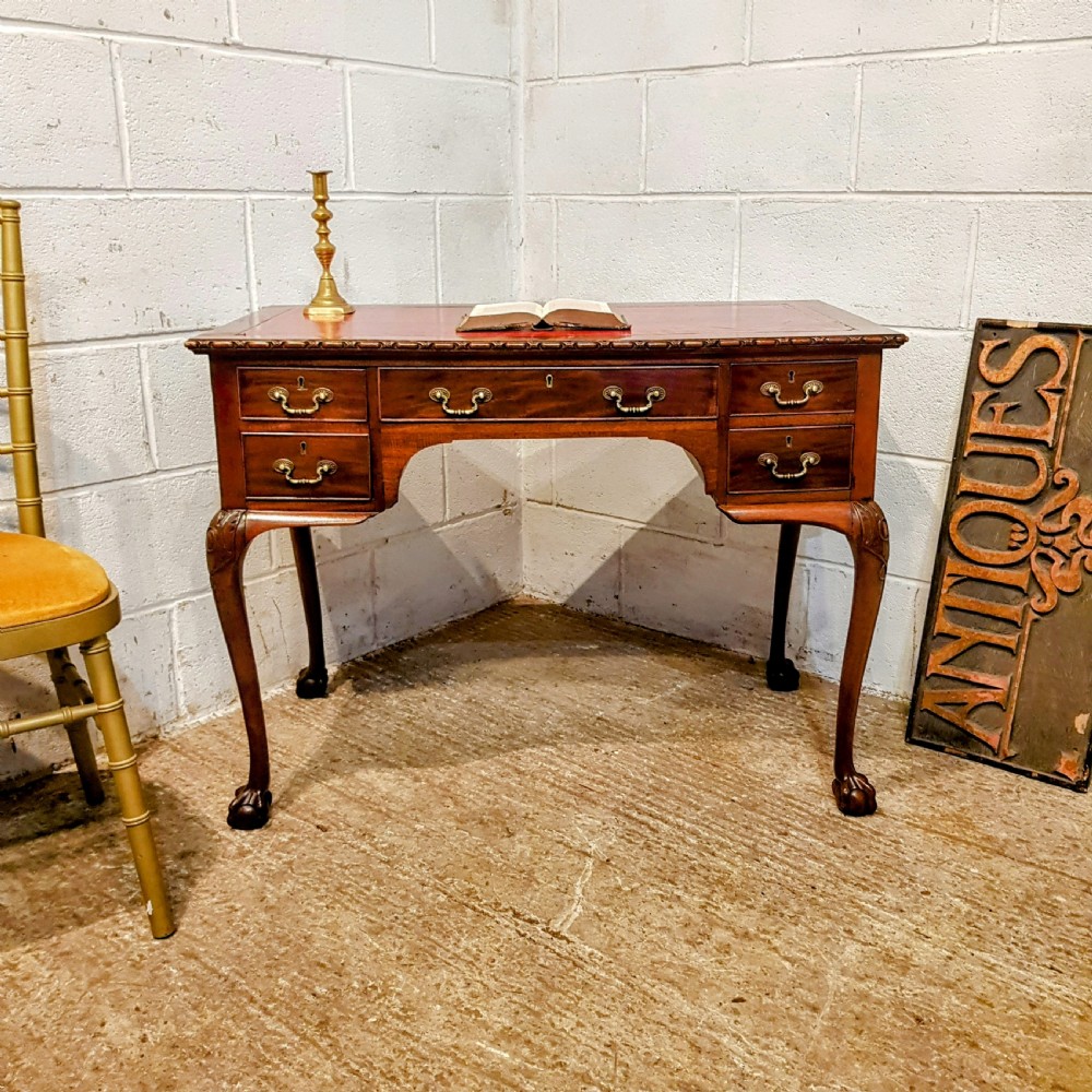 an antique small mahogany edwardian desk