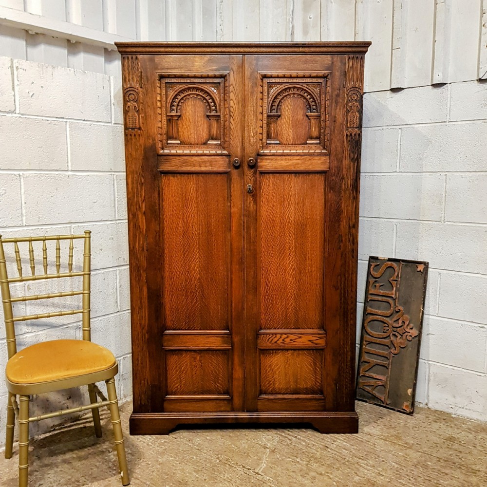an antique oak gentleman's fitted small wardrobe c1920