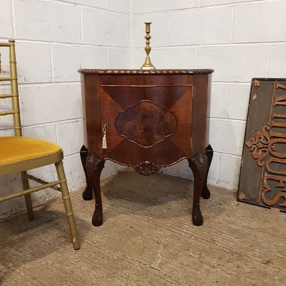 an antique walnut serpentine shaped small cabinet by maple co c1920