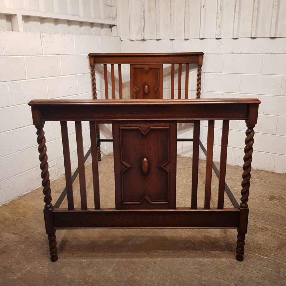 an antique oak double bed c1920