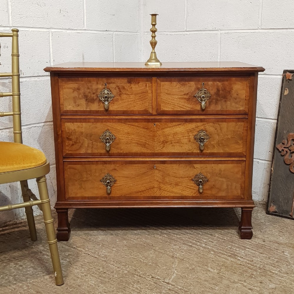 an antique walnut chest of drawers c1920