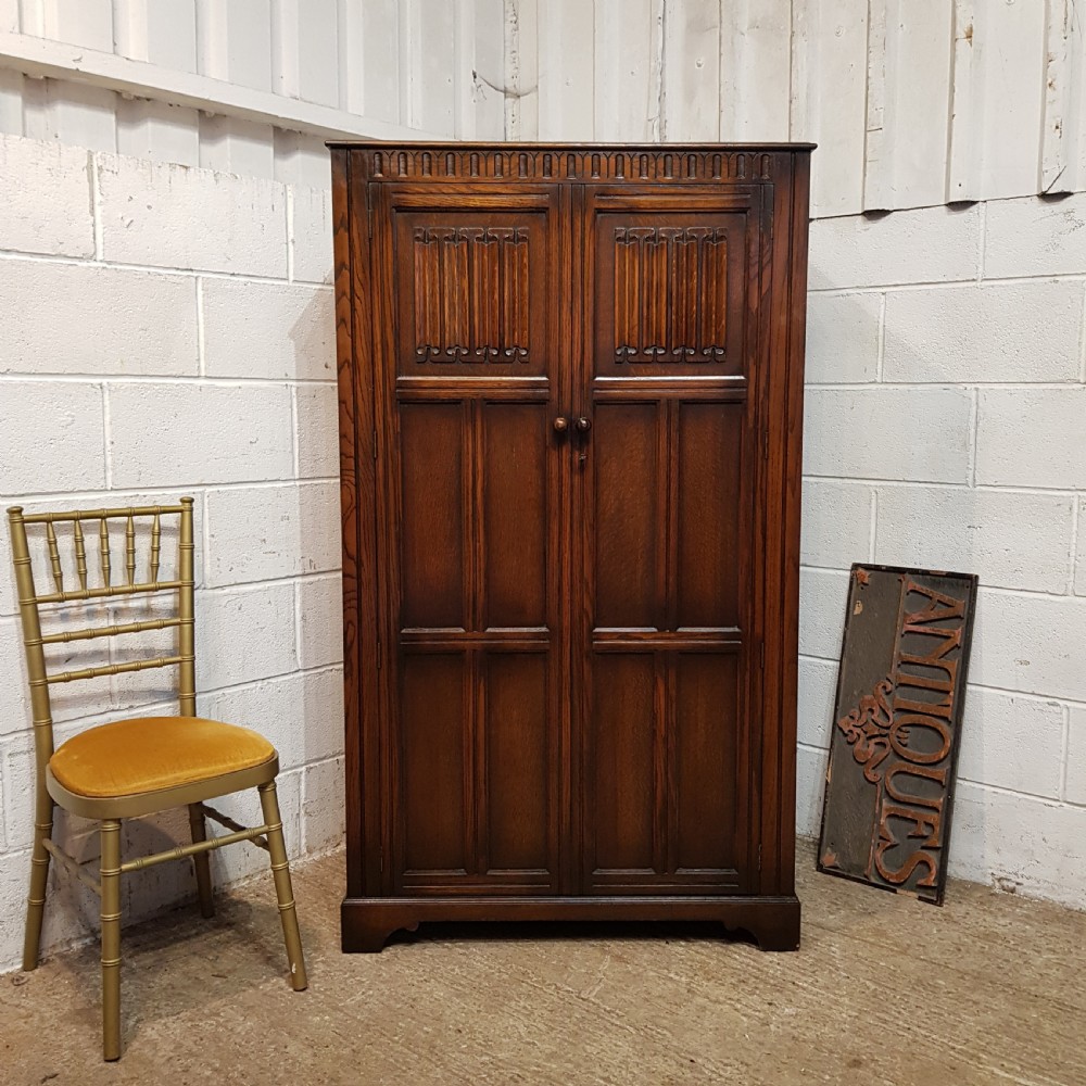 an antique small oak fitted wardrobe c1920