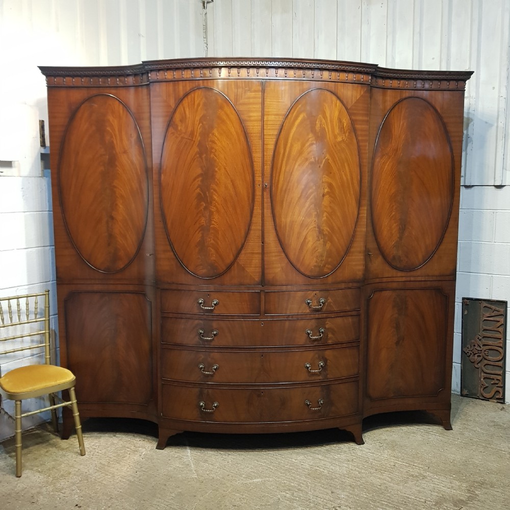 an antique large serpentine bow fronted breakfront triple wardrobe c1920