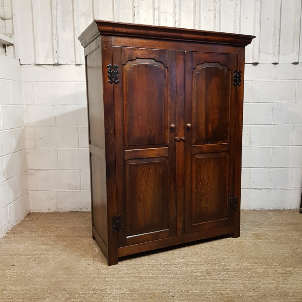 an antique small oak double wardrobe c1920