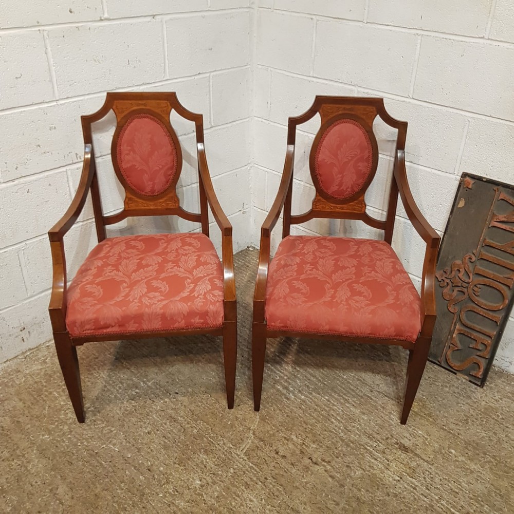 an antique pair of walnut library chairs c1920