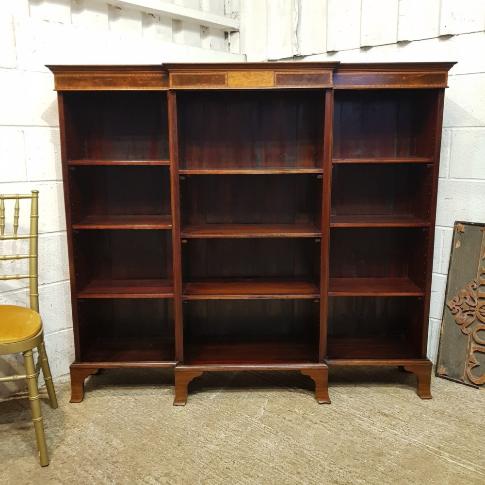 AN EDWARDIAN MAHOGANY BREAKFRONT OPEN BOOKCASE C1890 an edwardian mahogany breakfront open bookcase c1890