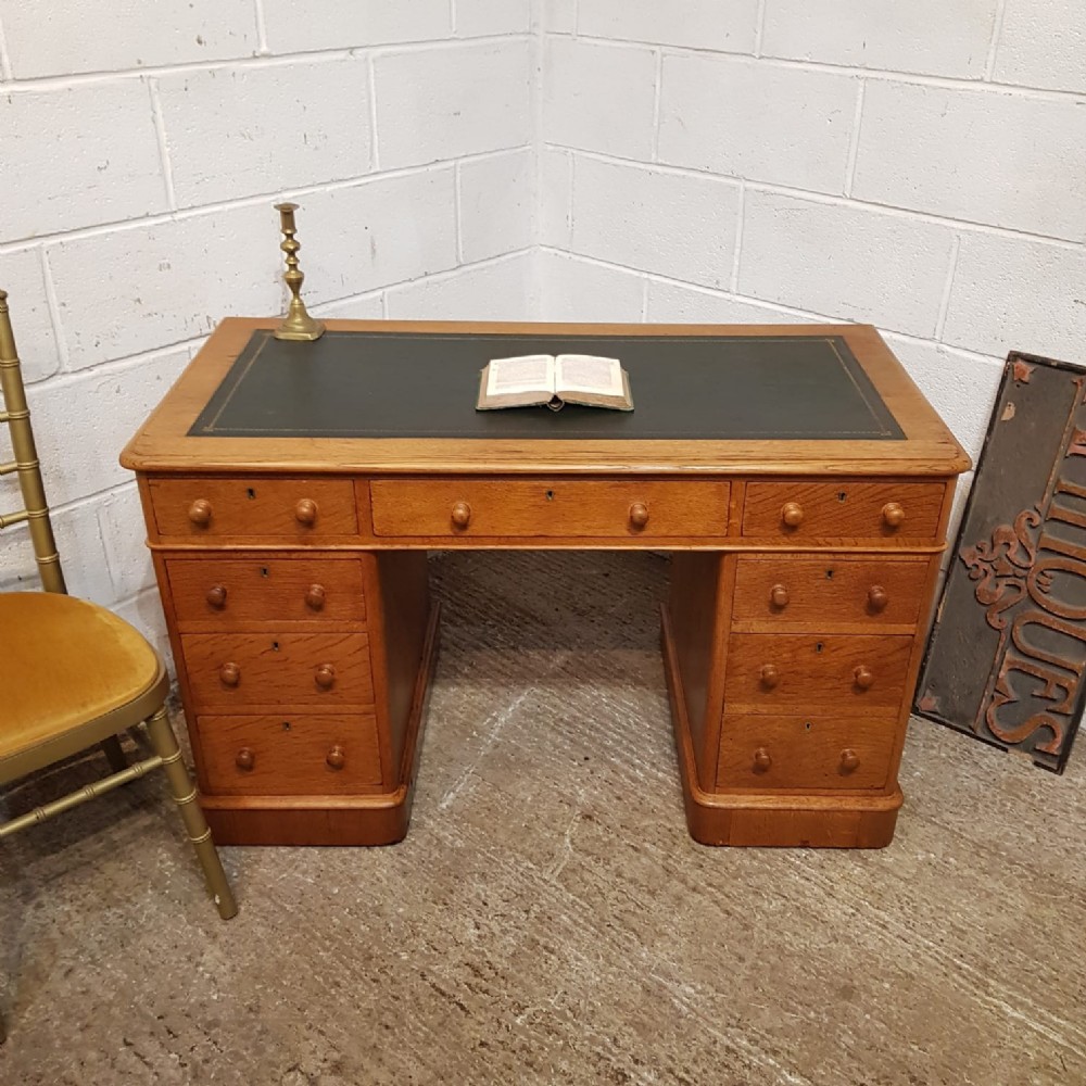 A VICTORIAN GOLDEN OAK TWIN PEDESTAL WRITING DESK C1880 a victorian golden oak twin pedestal writing desk c1880