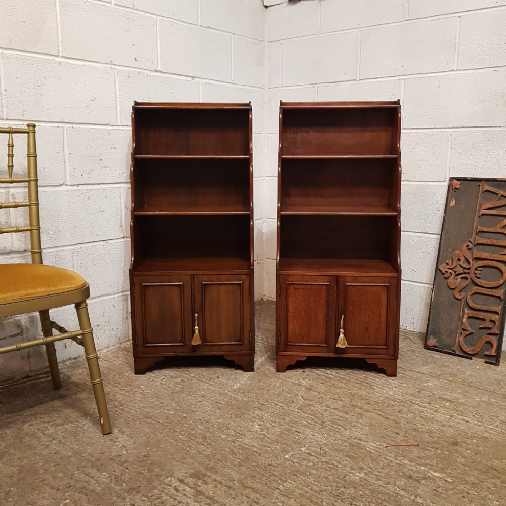 A PAIR OF EDWARDIAN MAHOGANY SMALL OPEN WATERFALL BOOKCASES C1900 a pair of edwardian mahogany small open waterfall bookcases c1900