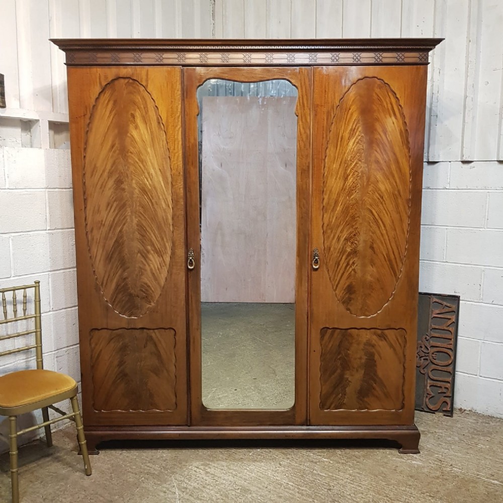 AN EDWARDIAN MAHOGANY TRIPLE WARDROBE C1900 an edwardian mahogany triple wardrobe c1900
