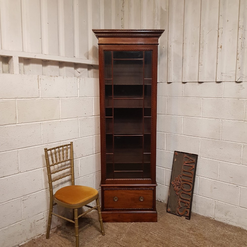 a tall mahogany glazed antique bookcase c1900