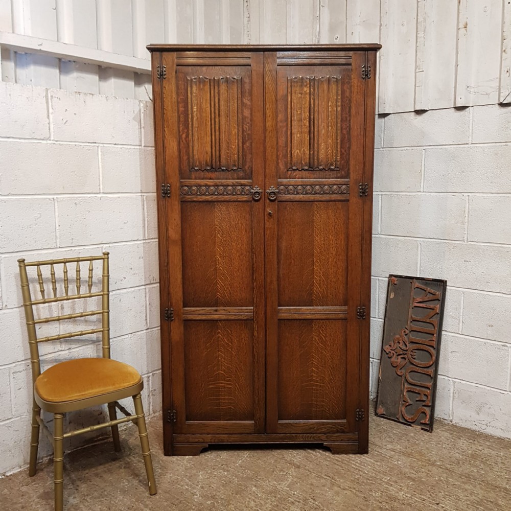 an antique oak double wardrobe c1920