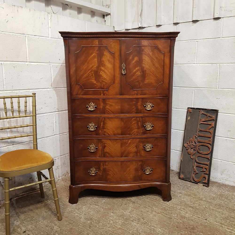 a mahogany chippendale style serpentine front tall boy chest by waring s gillows c1920
