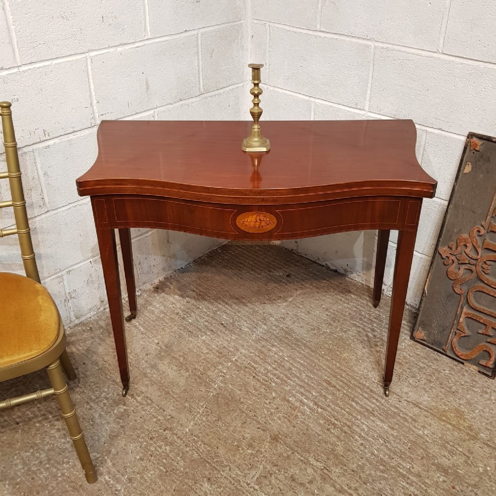 a george 3rd mahogany serpentine shaped fold over side table c1800