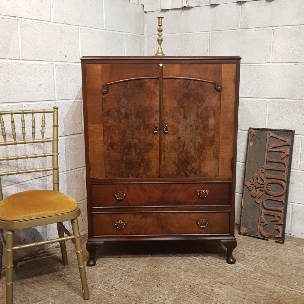 an antique walnut tallboy c1920