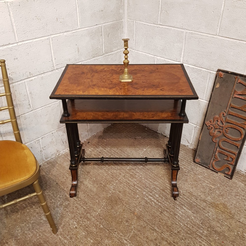 a late victorian etagere in ebony and burr walnut c1890