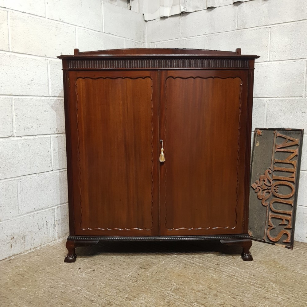 an edwardian bow fronted cupboard in mahogany c1900