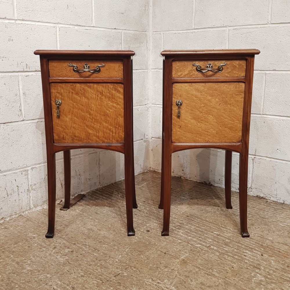 a pair of french mahogany and burr walnut bedside cabinets c1920