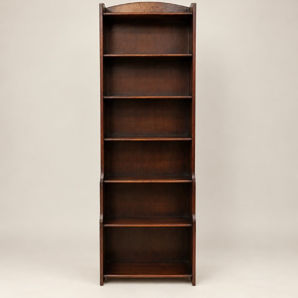 a tall narrow waterfall oak bookcase c1920